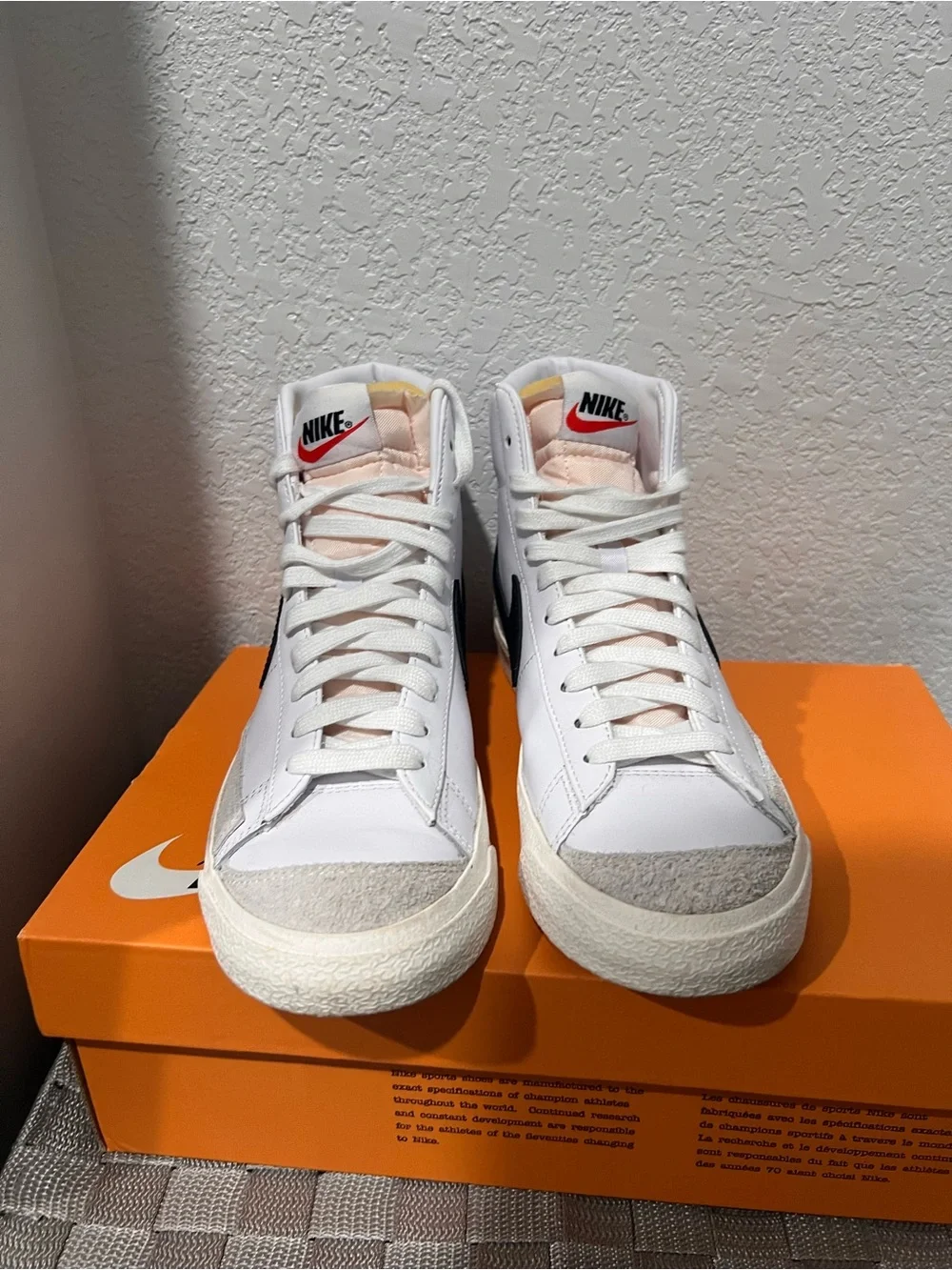 Nike White High-Top Sneakers with Black Swoosh